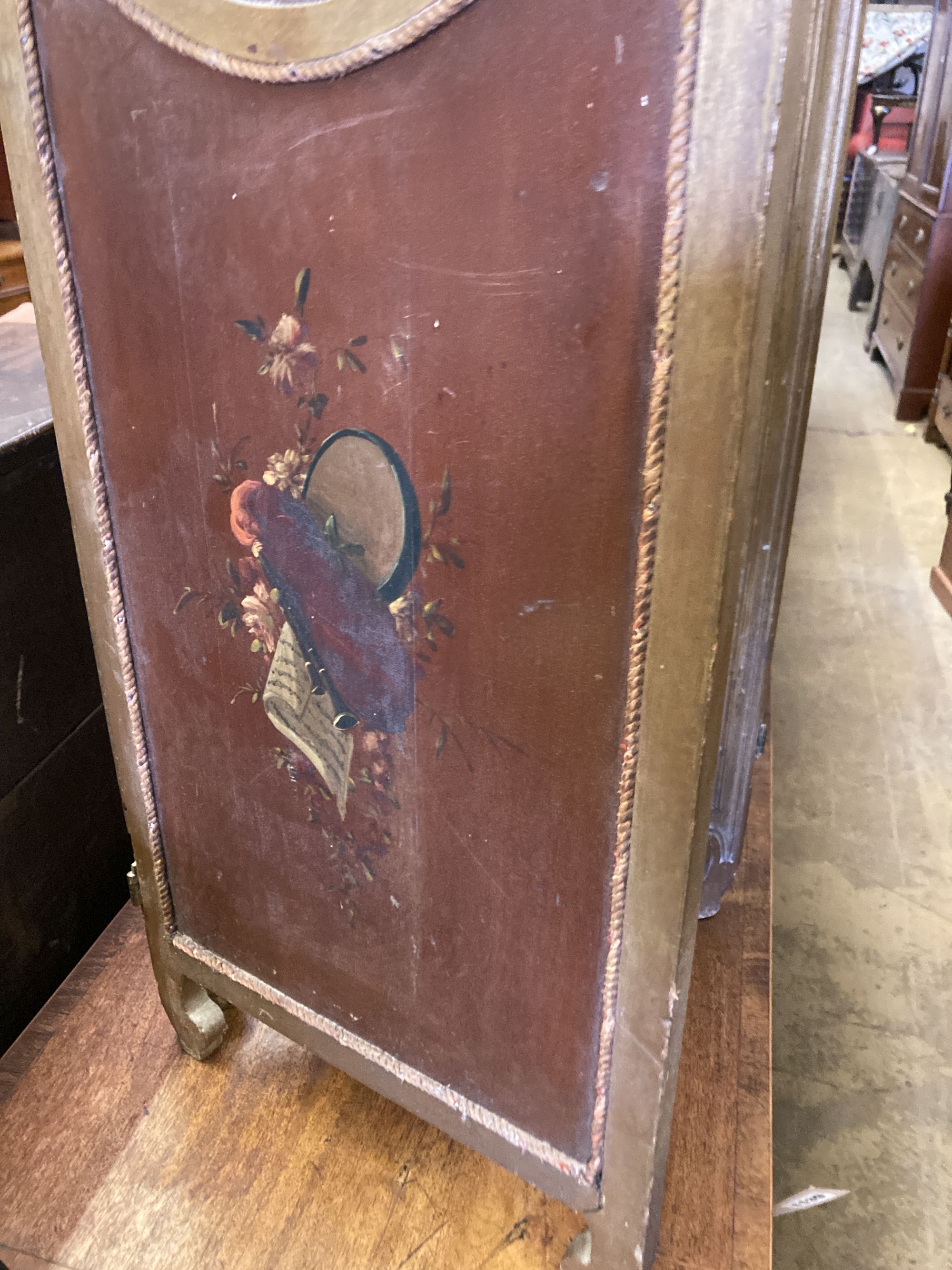 A small late 19th century painted glazed three fold screen, hand painted figures to the face side panels and decorative to the rear pan